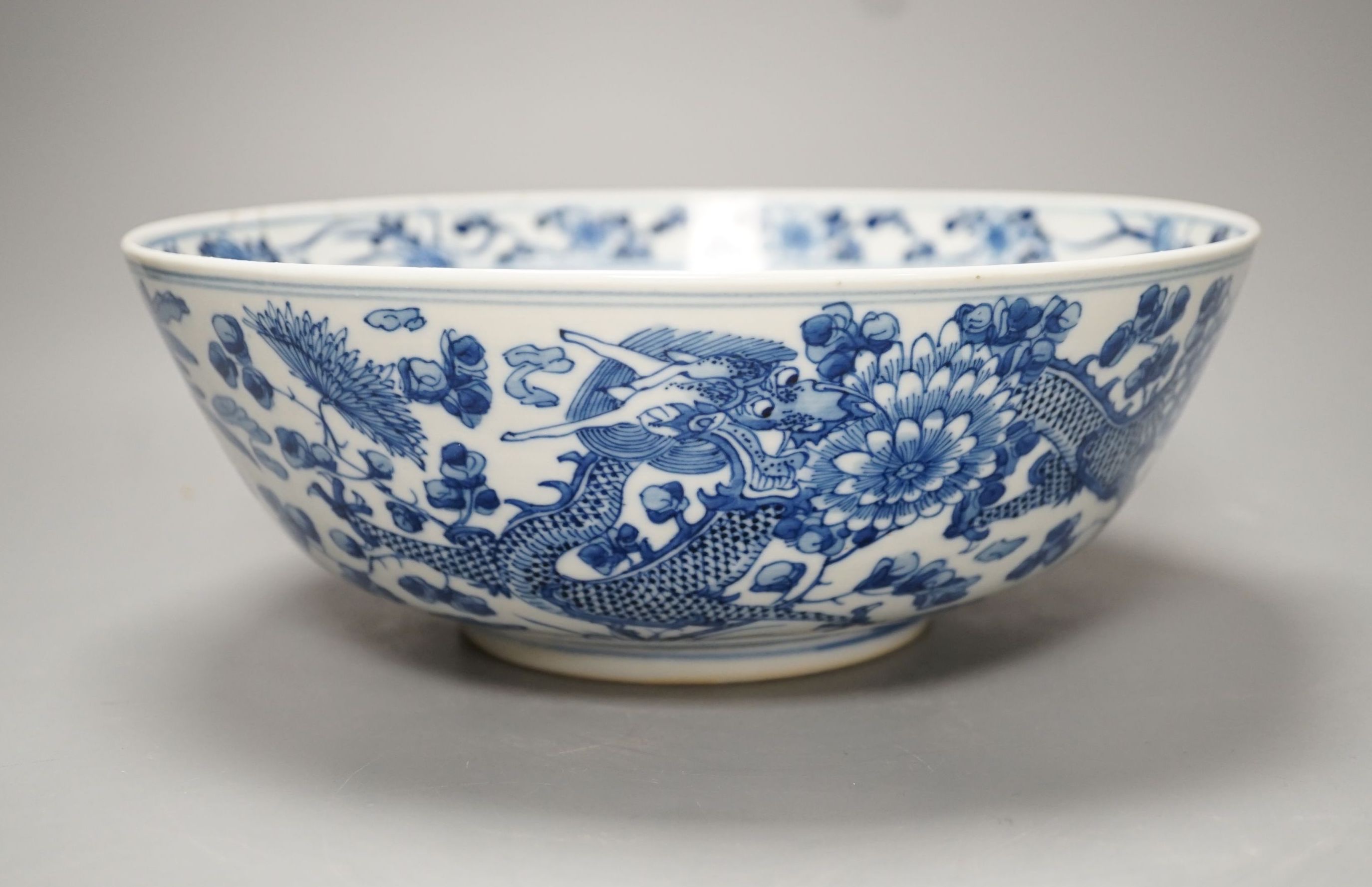 A 19th-century Chinese blue and white ‘dragon’ bowl - 27cm diameter